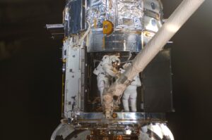 STS-125_EVA4_Working_inside_Hubble