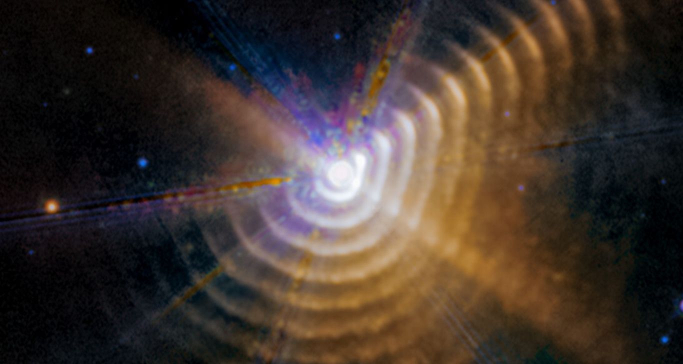 Wolf-Rayet 140: Le Fabbriche di Polvere Cosmiche Rivelate dal JWST